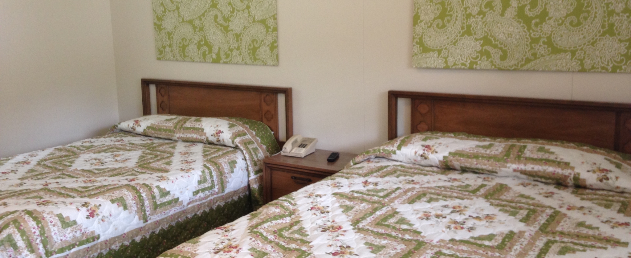 Two beds with geometric-patterned bedding